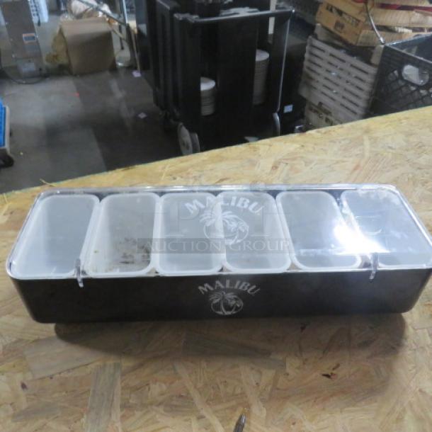 Malibu domed bar center with multiple compartments, black with logo, clear lids, used condition. Ideal for bar events.