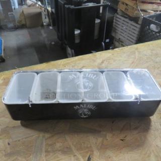 Malibu domed bar center with multiple compartments, black with logo, clear lids, used condition. Ideal for bar events.