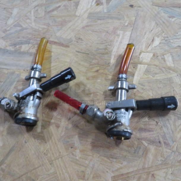 One lot of 32 Micro Matic keg couplers with visible hoses and levers, used condition, ideal for dispensing systems.