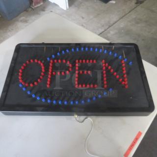 Illuminated "OPEN" sign, 22x13 inches, features red and blue bulbs. No cord included. Some wear visible on the frame.