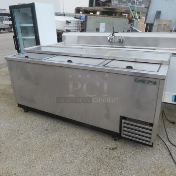 True Refrigerated Bottle Box, Model TD-80-30-S-HC, on casters, 80x27x37 inches, 115 Volt. Pre-owned condition.