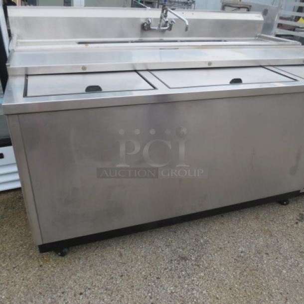 True refrigerated bottle box on casters, model TD-80-30-S-HC, 80x27x37 inches, stainless steel, 115V, built-in faucet.