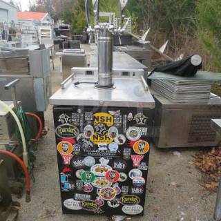 Micromatic MDD-23W kegorator, 1 door, dual zone, 115V, with 1 tower and 4 taps, 24x29x61 inches, sticker-covered front.