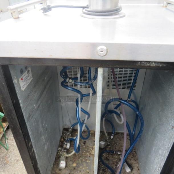 Micromatic MDD-23W kegorator interior, showing dual zone wine dispenser setup with coiled lines, one tower, and four taps.