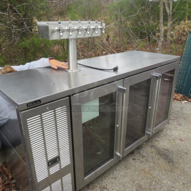 Perlick glass door kegorator, Model BBSN-72-RO-1, with one tower, six taps, on casters, 115V; labeled with logo.