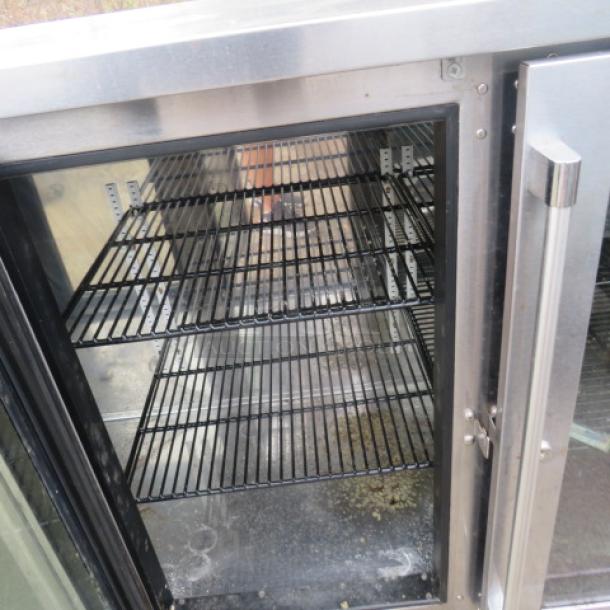 Perlick 3-door glass cooler, model BBSN-72-RO-1, with 2 racks, on casters, 115V, 72x25x38 inches, excellent condition.