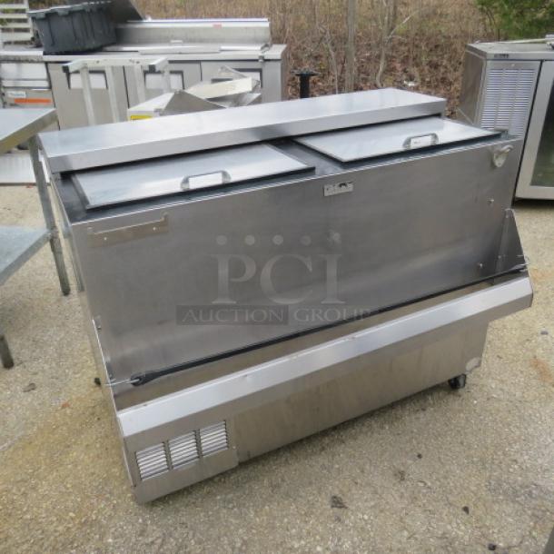 Perlick bottle box with bottle rail, model BC48, on casters, stainless steel, 48x24x38 inches, 115V, excellent condition.