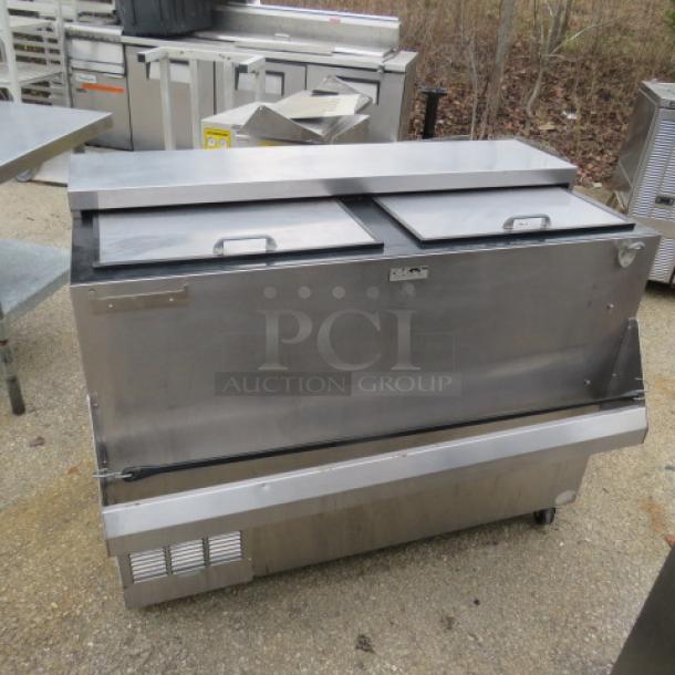 Perlick BC48 bottle box with bottle rail, stainless steel, on casters, 115V, 48x24x38 inches.