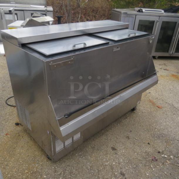 Perlick BC48 bottle box with attached rail, on casters. Stainless steel. 48x24x38 inches. 115 Volt. Good condition.