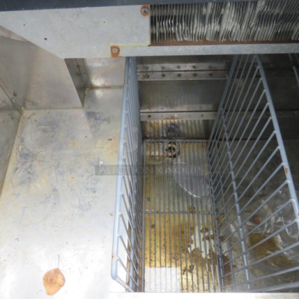 One Perlick Bottle Box, Model BC48, with bottle rail and casters, 48x24x38 inches, 115V, stainless steel interior.