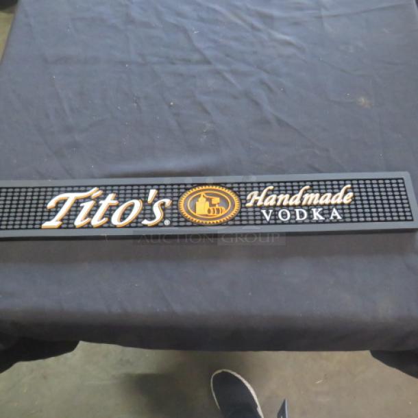 Tito's Handmade Vodka bar mat, black with logo and text, excellent condition, rubber material, ideal for bar settings.