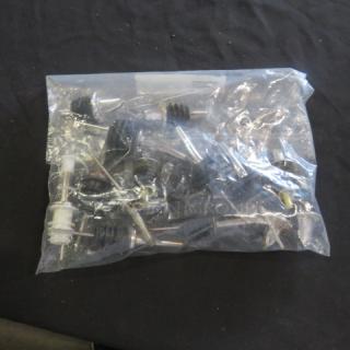 Bag of assorted pourers in good condition, featuring various metal spouts and rubber stoppers, ideal for bar use.
