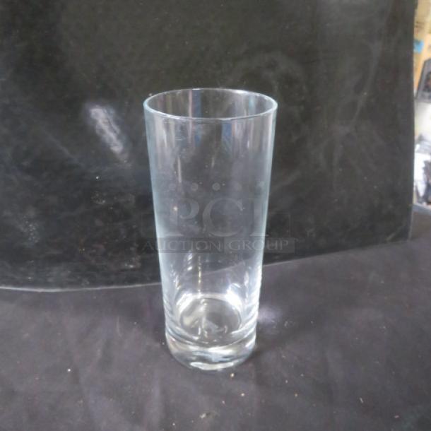 Clear tall bar glass, model 12XBID, in excellent condition, no visible scratches or chips. Perfect for serving beverages.