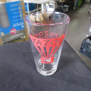 New Yazoo beer glass with red logo. Pint-sized. Clear glass. Excellent condition. Ideal for collectors or fans.