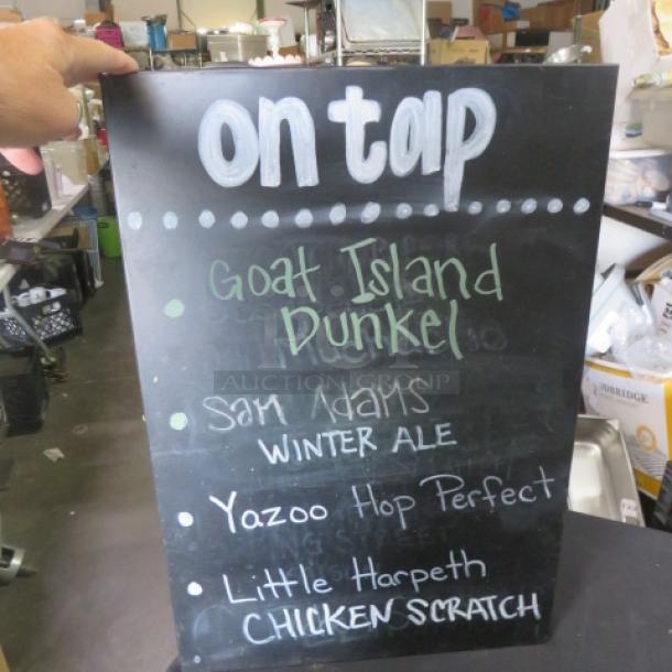 Black metal beer sign, 14x20.5 inches, featuring "On Tap" and listings for Goat Island Dunkel, Sam Adams Winter Ale, Yazoo Hop Perfect, Little Harpeth Chicken Scratch. Used condition.