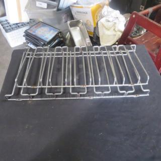 Metal wine glass rack, 22x10 inches, holds multiple glasses, silver finish, good condition, suitable for bar or kitchen use.