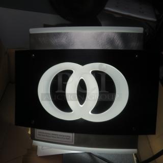 Kool LED lighted sign, new condition, featuring interlocking circles design. Made of metal and acrylic, ready for display.