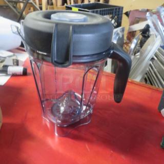New 64oz pitcher with lid, clear body, black top and handle. Ideal for blending, in excellent condition.