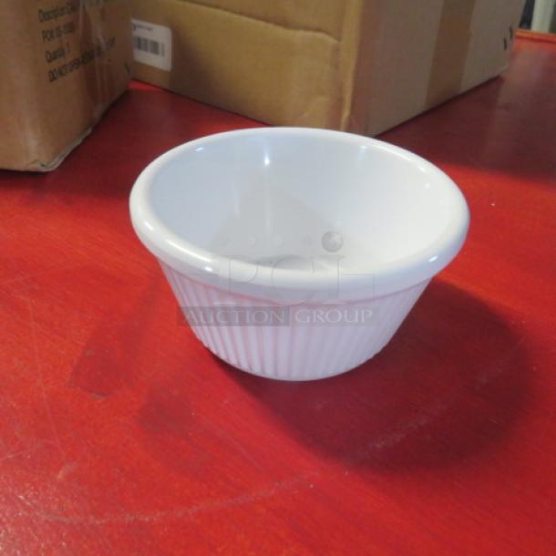 New 4oz white ceramic ramekin with ribbed exterior, pristine condition, ideal for baking or serving.