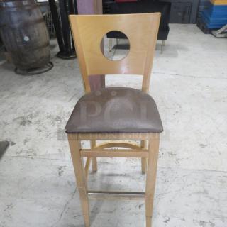 Wooden Bar Height Chair With A Brown Cushioned Seat And Footrest. 2XBID - Item #1223482