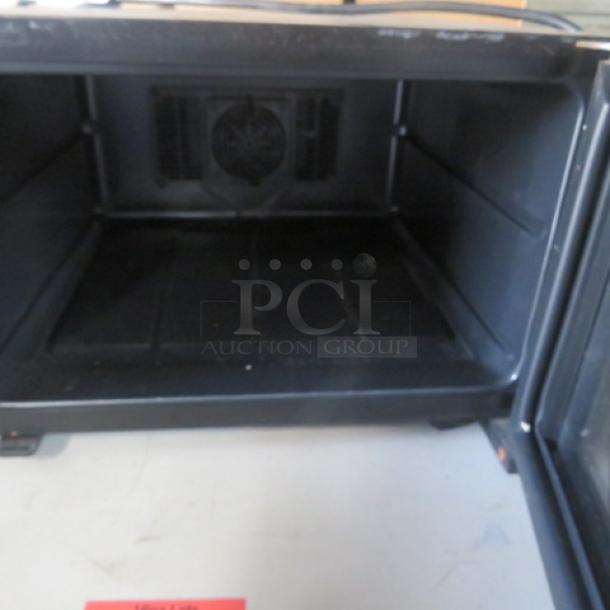 Frigidaire Wine Cooler, model FWC084HM, 110 Volt, working condition, interior view of shelving and cooling fan.