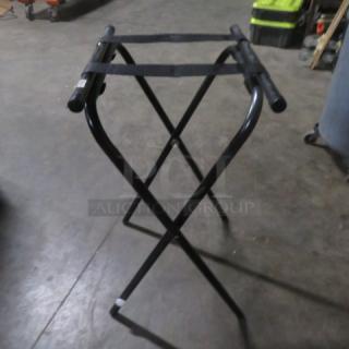 One Tray Stand, black metal frame, collapsible design, fabric straps on top, used condition, suitable for serving trays.