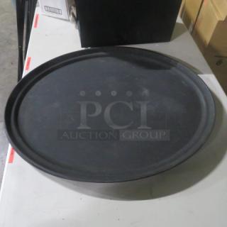 Black 27x22 inch oval serving tray in used condition, featuring a raised edge for stability.