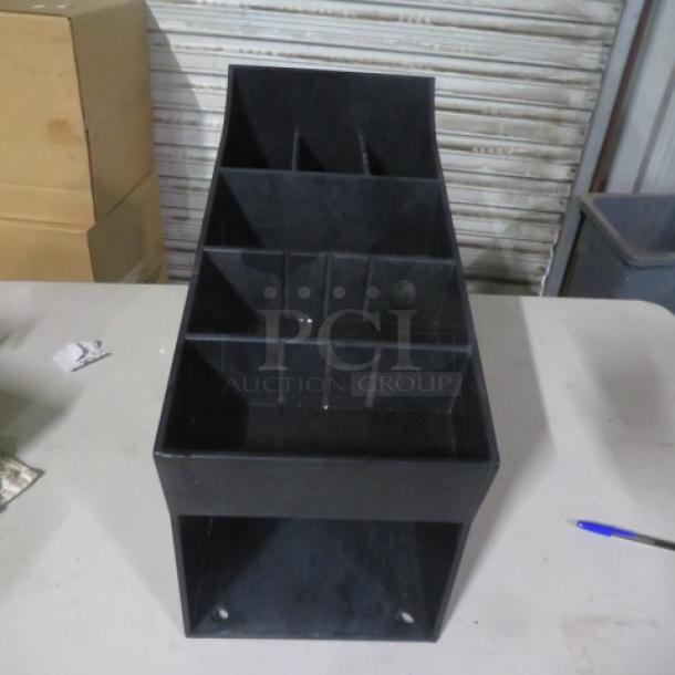 Black poly organizer with multiple compartments, dimensions 8.5x17x14.5 inches, in good condition.