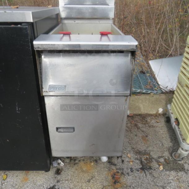 Pitco natural gas deep fryer with 2 baskets, on casters, 16x35x46 inches, stainless steel, industrial-grade, used condition.