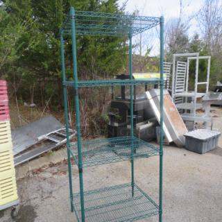 Green Metro shelf with 4 adjustable wire shelves, dimensions 30"x24"x75". Used condition, suitable for storage needs.