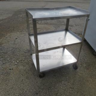Stainless steel 3-shelf cart on casters, dimensions 24x16x33 inches, used condition, suitable for storage or transport.