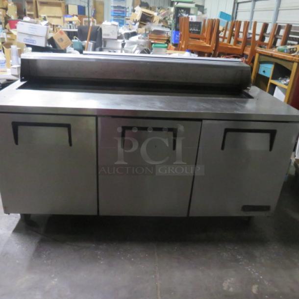 True 3-Door Refrigerated Prep Table, Model TSSU-72-18, on casters, missing lid, 72.5x30x44 inches, 115 Volt, good condition.