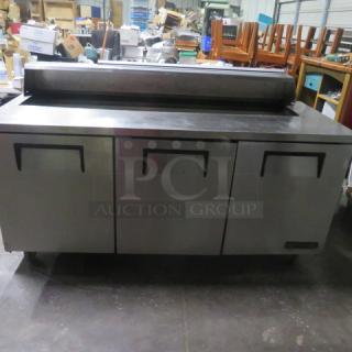 One WORKING  True 3 Door Refrigerated Prep Table On Casters. Model# TSSU-72-18. Missing Lid. 115 Volt. 72.5X30X44. - Item #1223807