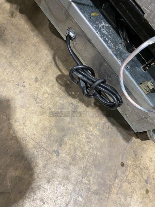 Frymaster stainless steel dual-tank deep fat fryer, model 2FQG30U0ZQTZBNG, on casters, with backsplash and basket hanger.