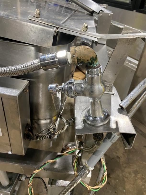 Groen NFHPE4 stainless steel 40-gallon tilt skillet/tilted braising pan. Features single spout faucet, natural gas powered, 1 phase, on legs. Visible wear, suitable for commercial use.