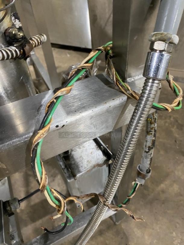 Groen NFHPE4 commercial stainless steel tilt skillet, 40 gal, natural gas, single spout faucet, on legs, wiring visible.