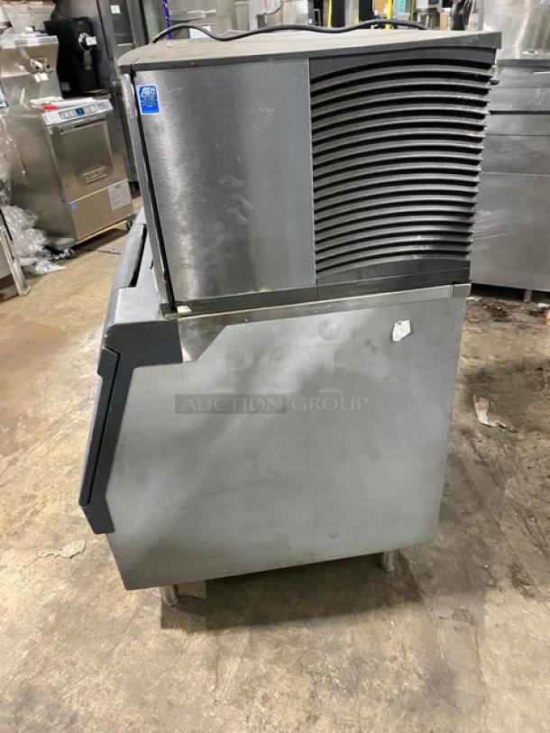 Manitowoc stainless steel ice machine, Model SD0303W, water-cooled, electric-powered, on legs, visible wear, 115V 1 Phase.