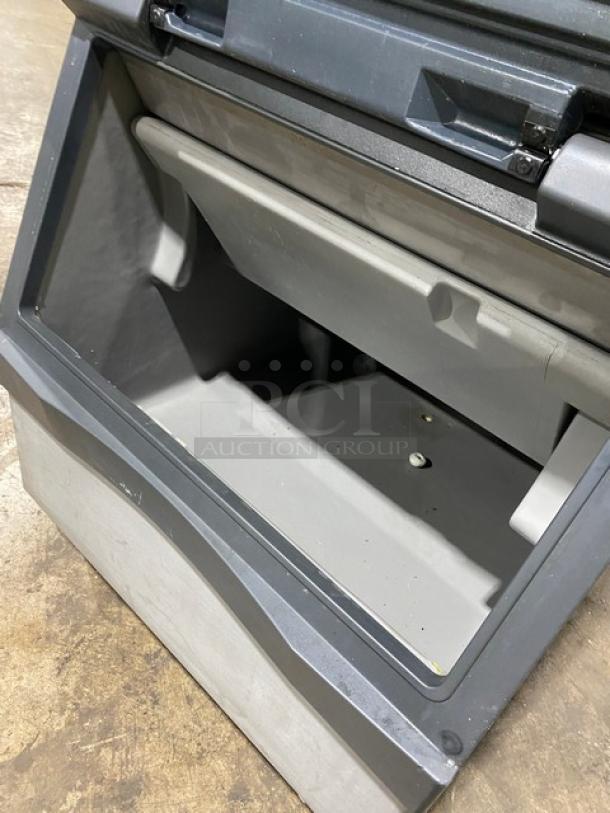 Manitowoc SD0303W stainless steel ice machine/bin combo, electric, water-cooled, on legs, spacious interior.