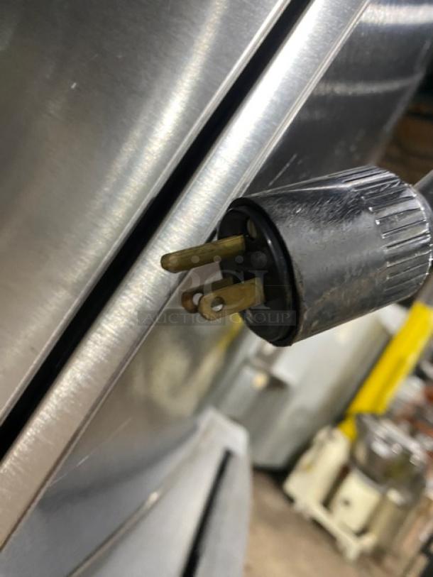 Manitowoc SD0303W stainless steel ice machine, water-cooled, electric, 115V, 1 phase, on legs, power plug shown.