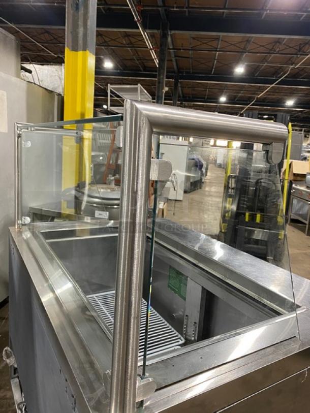 Atosa MSF8306 stainless steel 2-door refrigerated prep table with sneeze guard and poly-coated rack on casters, 115V.