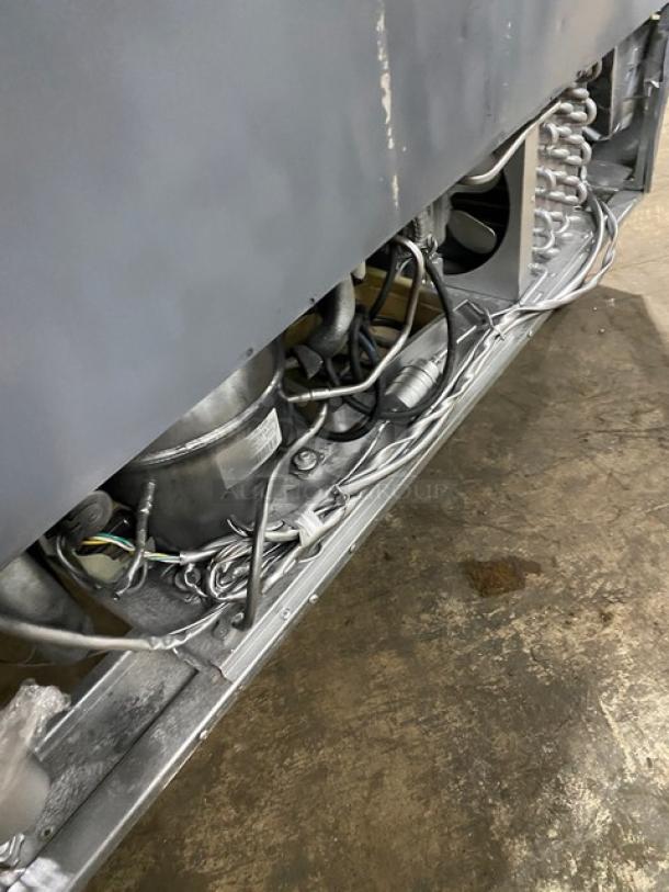 Atosa Model MSF8306 refrigerated prep table, stainless steel, two doors, sneeze guard, poly-coated rack, on casters.