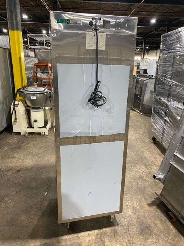 Alto-Shaam 1200UPSR stainless steel dual-compartment heated cabinet with upper/lower controls, wired rack, on casters.