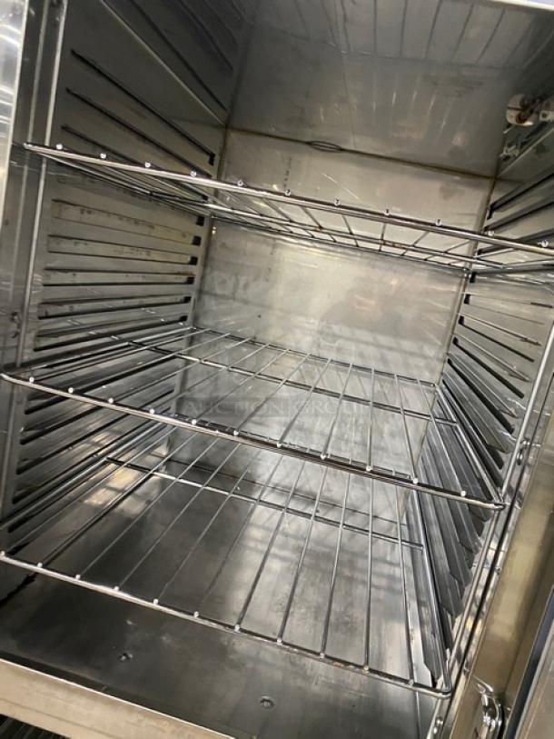 Alto-Shaam 1200-UP/SR dual-compartment stainless steel cabinet with wired oven rack, Dutch door, model 1200-UP/SR, 1 phase, on casters.