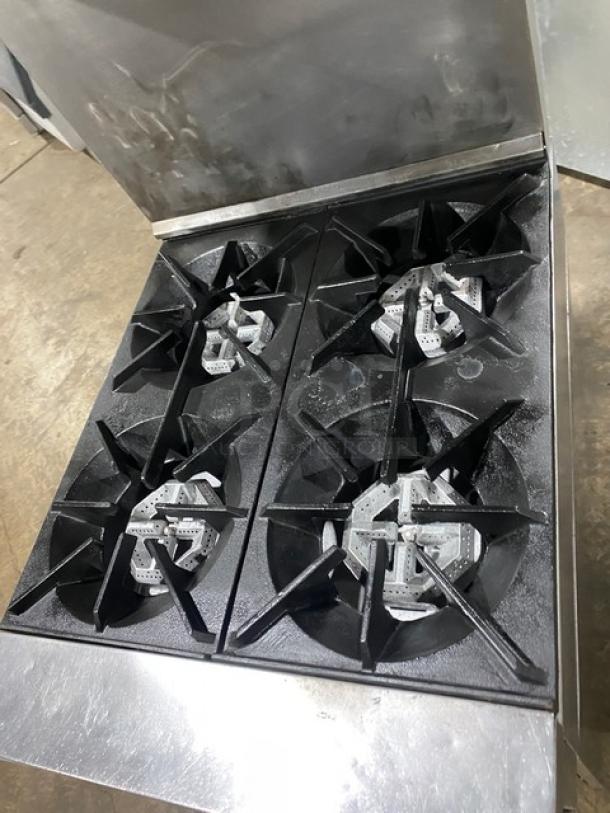 SunFire stainless steel 4-burner range/oven, natural gas, includes backsplash, overhead salamander shelf, and wired oven rack.