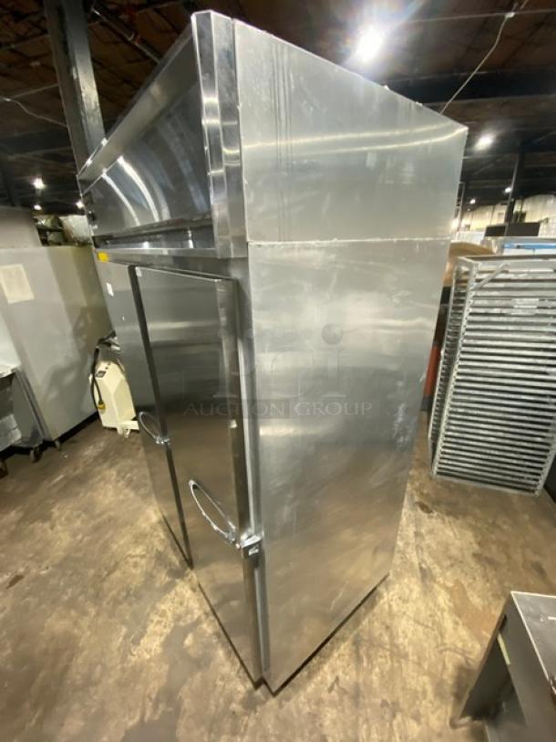 Continental 2F stainless steel reach-in freezer, dual solid doors, poly-coated wire rack, on casters, model 2F SN: 159A2367.