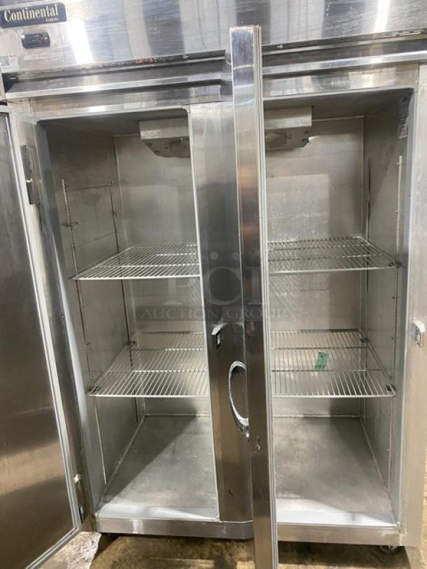 Continental 2F stainless steel 2-door reach-in freezer, poly-coated wired rack, model 2F, SN 159A2367, on casters, 115V 1 phase.