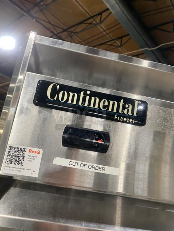 Continental Commercial Stainless Steel 2-Door Freezer, Model 2F, with "Out of Order" tag, poly-coated wired rack, on casters.