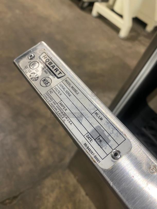 Hobart LXEC commercial dishwasher label showing model, serial number, and energy certifications. Stainless steel construction.