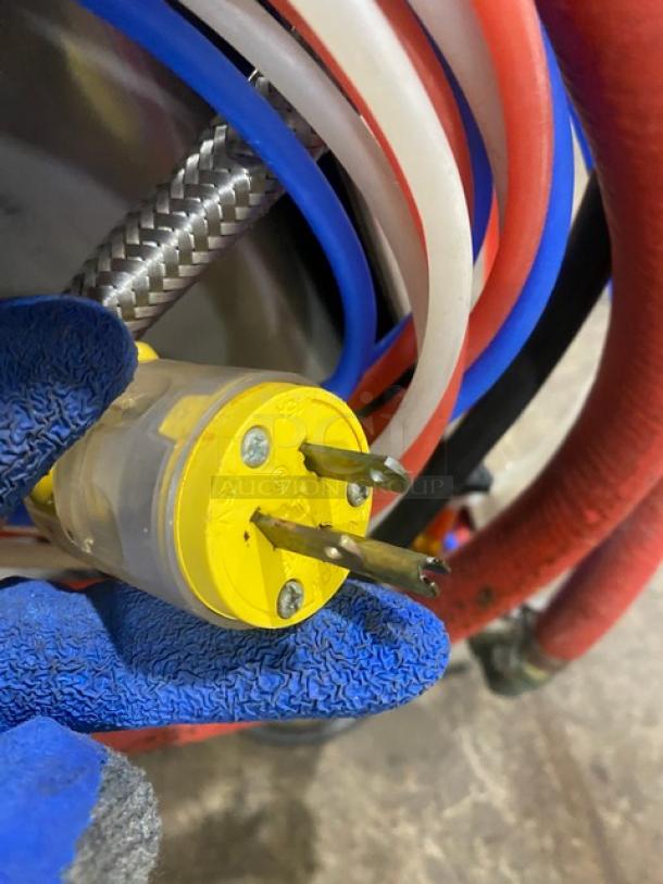 Yellow electrical plug associated with Hobart LXEC dishwasher, showing power connection.