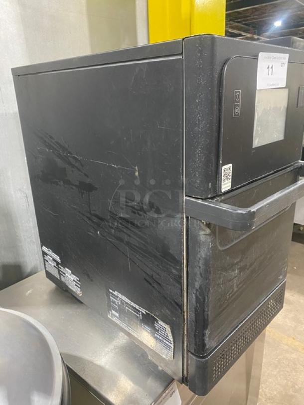 MerryChef Eikon E2S black electric countertop rapid cook oven, 208/240V, 1 phase, visible wear, model markings on the side.